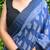 Blue hand block printed linen saree with stripe blouse