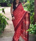 Red hand block printed linen saree with stripe blouse
