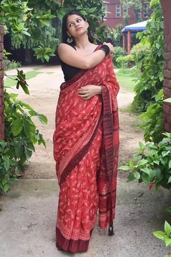 Red hand block printed linen saree with stripe blouse