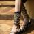 Black with long tie-up flats with gold studs.