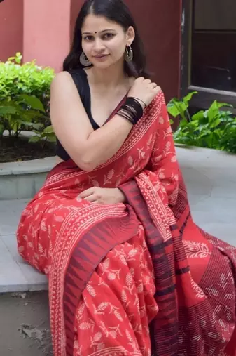 Red hand block printed linen saree with stripe blouse