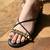 Black with long tie-up flats with gold studs.