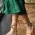 Tie-up flats with gold studs.