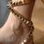 Tie-up flats with gold studs.