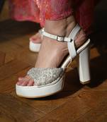 White platform block heels with silver beadwork.