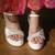 White platform block heels with silver beadwork.