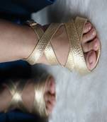 Gold cross strap block heels with ankle strap