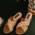 Gold criss cross strap block heels with schell and pearl handwork