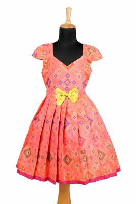 Girls orange floral patola pattu pavadai frocks 1
