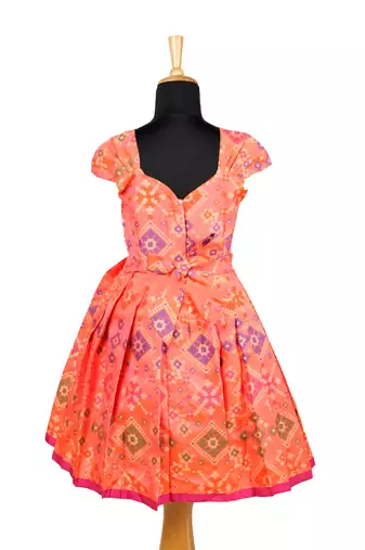Girls orange floral patola pattu pavadai frocks