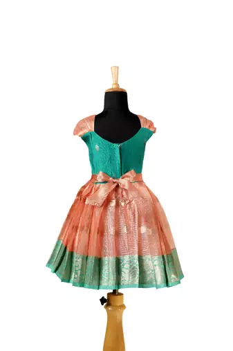 Girls peach floating mango butta pattu pavadai frocks