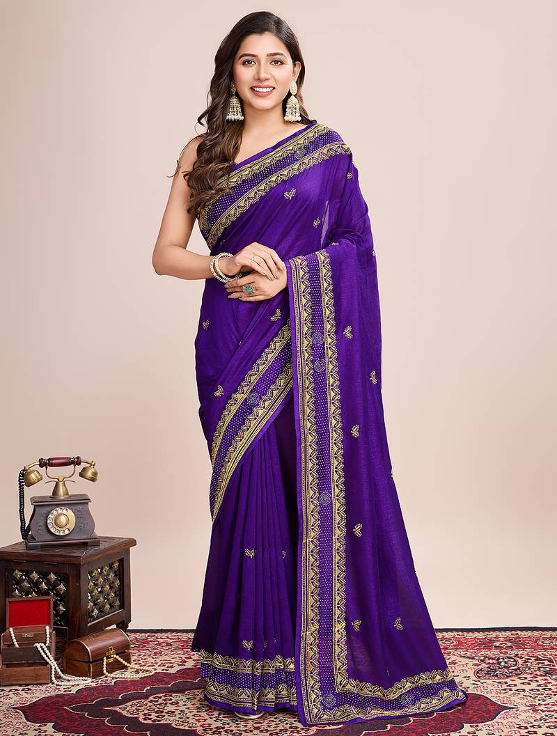 purple silk blend saree with contrast zari border pallu and matching blouse