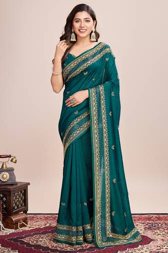 turquoise silk blend saree with contrast zari border pallu and matching blouse