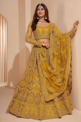 mustard yellow net function wear lehenga choli with dupatta