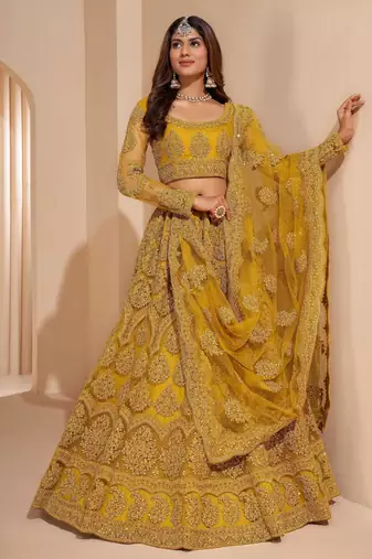 mustard yellow net function wear lehenga choli with dupatta