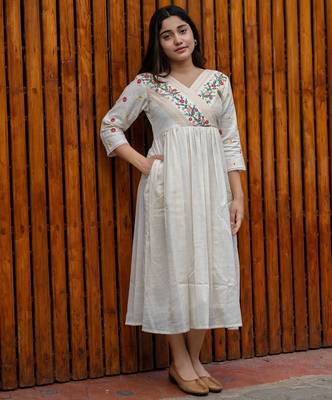 off-white cotton Kurti designed with floral embroidery and crochet lace detailing 1