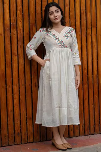 off-white cotton Kurti designed with floral embroidery and crochet lace detailing