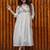 off-white cotton Kurti designed with floral embroidery and crochet lace detailing