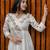 off-white cotton Kurti designed with floral embroidery and crochet lace detailing