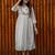 off-white cotton Kurti designed with floral embroidery and crochet lace detailing