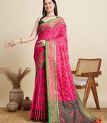 pink patola silk blend saree with contrast weave meenakari & tassels