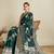 dark green satin saree with contrast zari border and blouse