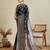 navy blue satin saree with contrast zari border and blouse