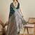 green satin saree with contrast zari border and blouse