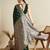 green satin saree with contrast zari border and blouse