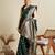 green satin saree with contrast zari border and blouse