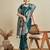 green satin saree with contrast zari border and blouse