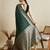 green satin saree with zari motifs contrast border and blouse