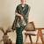 green satin saree with zari motifs contrast border and blouse