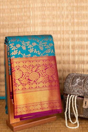 Peacock blue  gold zari woven semi silk saree