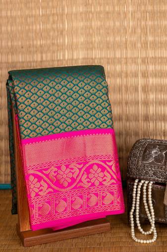 Dual tone green and pink golden zari motifs semi silk saree