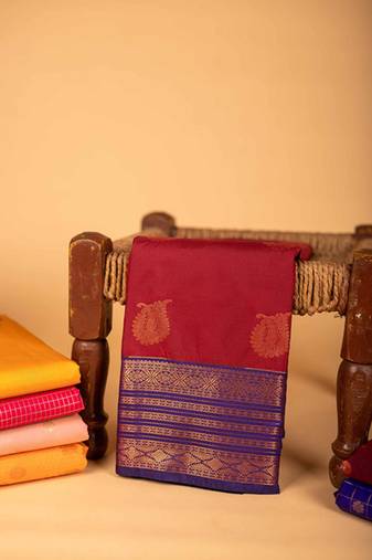 Maroon gold zari pattern semi soft silk saree