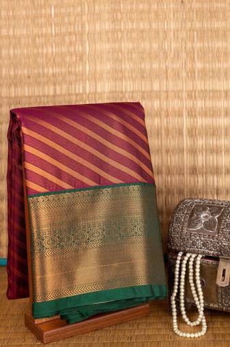 Purple and green zari weaven semi silk saree
