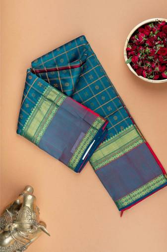 Peacock green floral motifs silk cotton saree