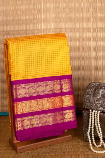 Yellow and purple silk cotton saree