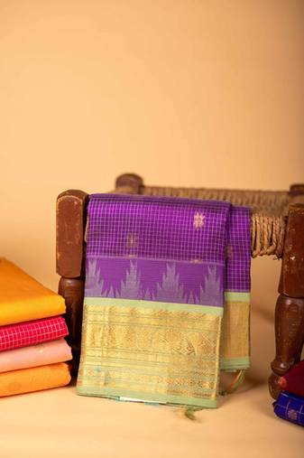 Pastel green and purple silk cotton saree