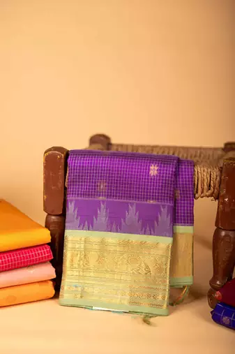 Pastel green and purple silk cotton saree