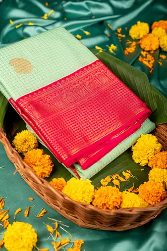 Aqua green and reddish pink semi silk saree