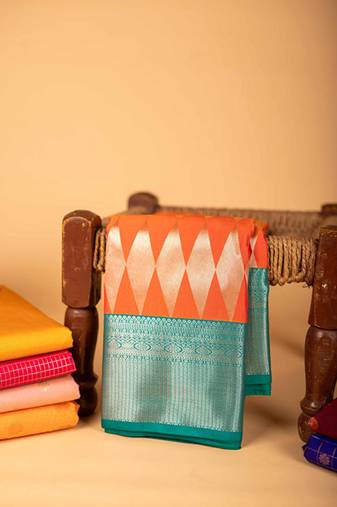Orange woven semi soft silk saree