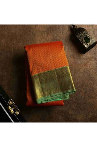Reddish orange bridal silk saree