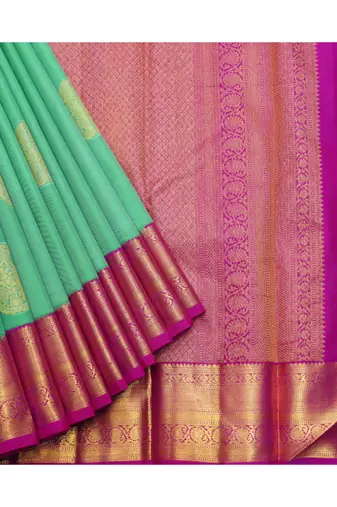Light green silk saree with pink border