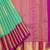 Light green silk saree with pink border