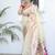 cream paithani silk blend zari motifs saree with contrast blouse