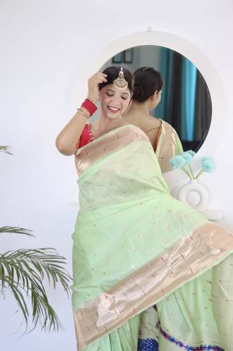green paithani silk blend zari motifs saree with contrast blouse