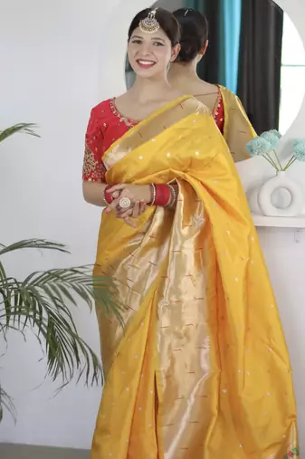 yellow paithani silk blend zari motifs saree with contrast blouse