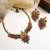 Gold plated gaj necklace set with red green hydra beads